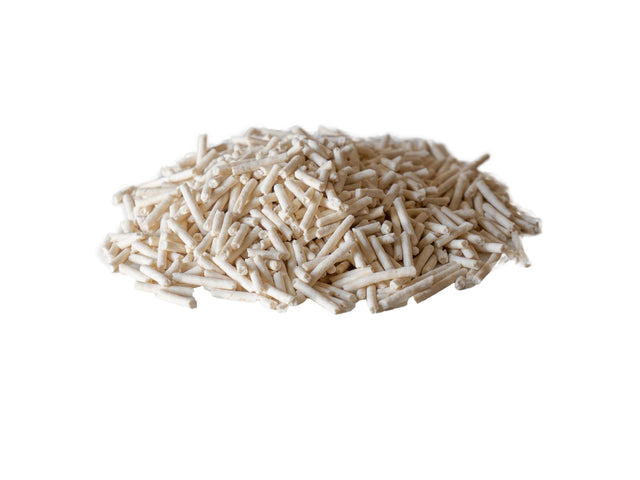 A handful of natural tofu cat litter pellets